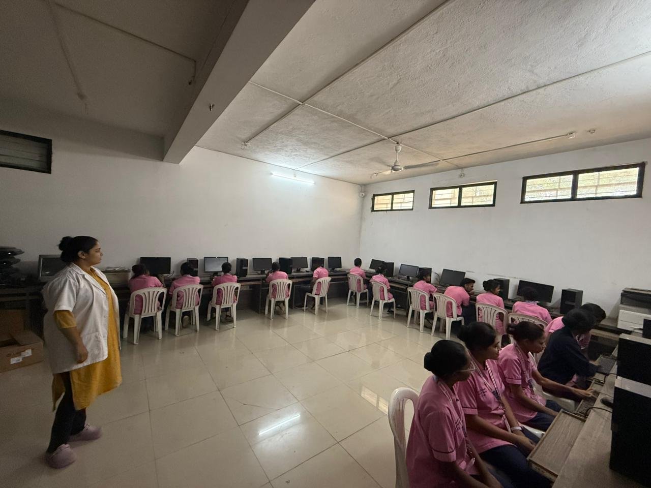 Computer lab – wide room overview with students